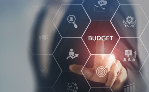 an image of budget and various factors that relate to budgeting around it