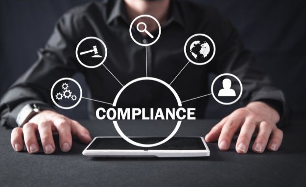 an image of compliance and various icons that feed into it